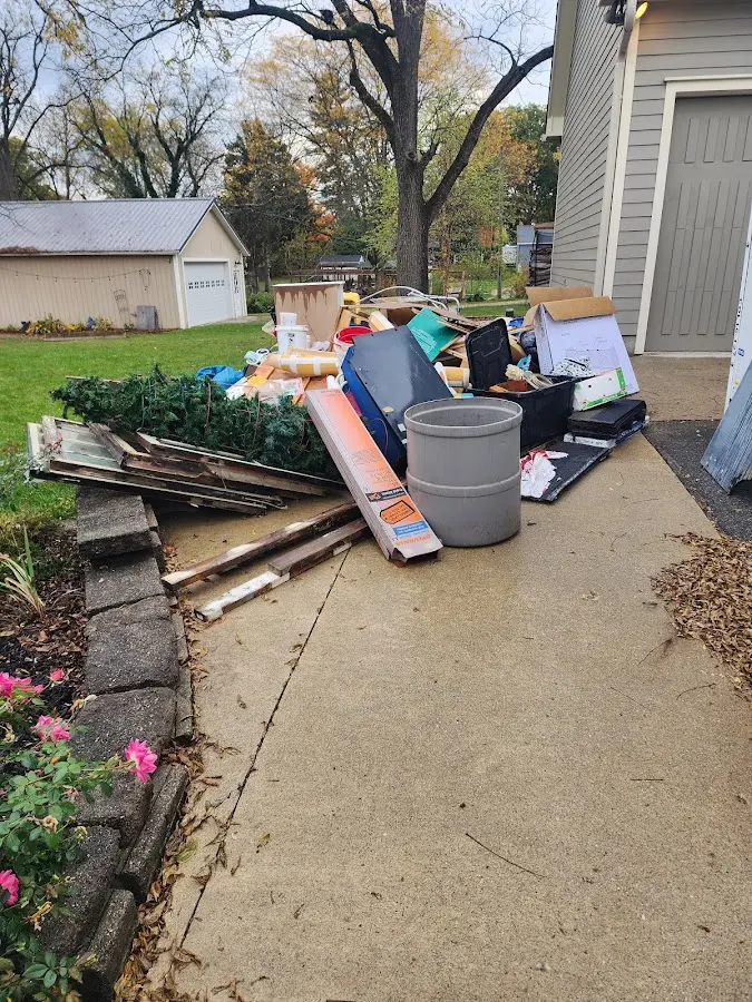 Dumpster being loaded with debris for 3 Yard Dumpster Rental in Bluffton
